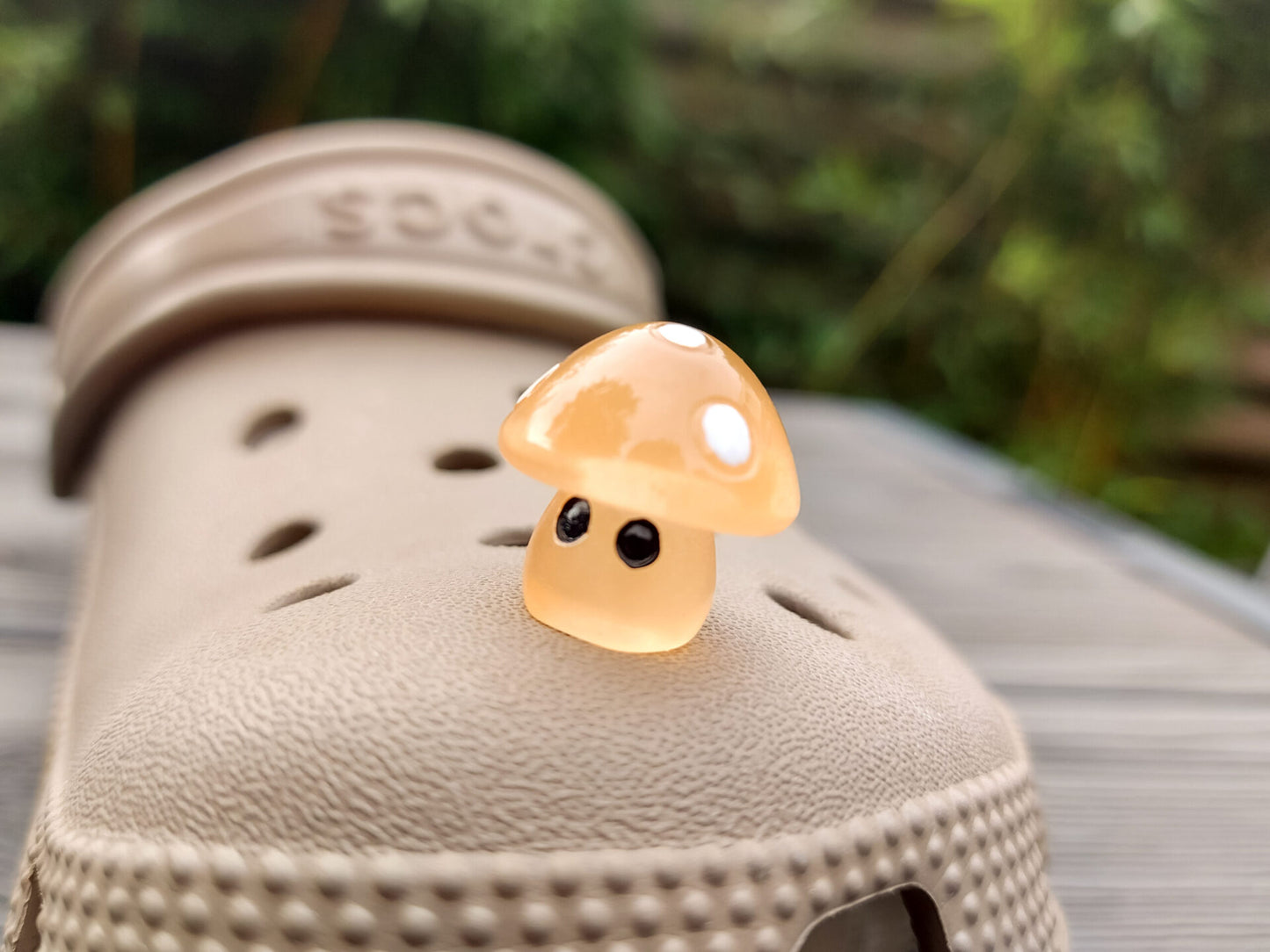 Glow-in-the-dark mushroom charms on a pair of shoes shoes. These luminous accessories add a magical, whimsical touch to your footwear, perfect for customizing with a unique forest-inspired design that glows beautifully in the dark.