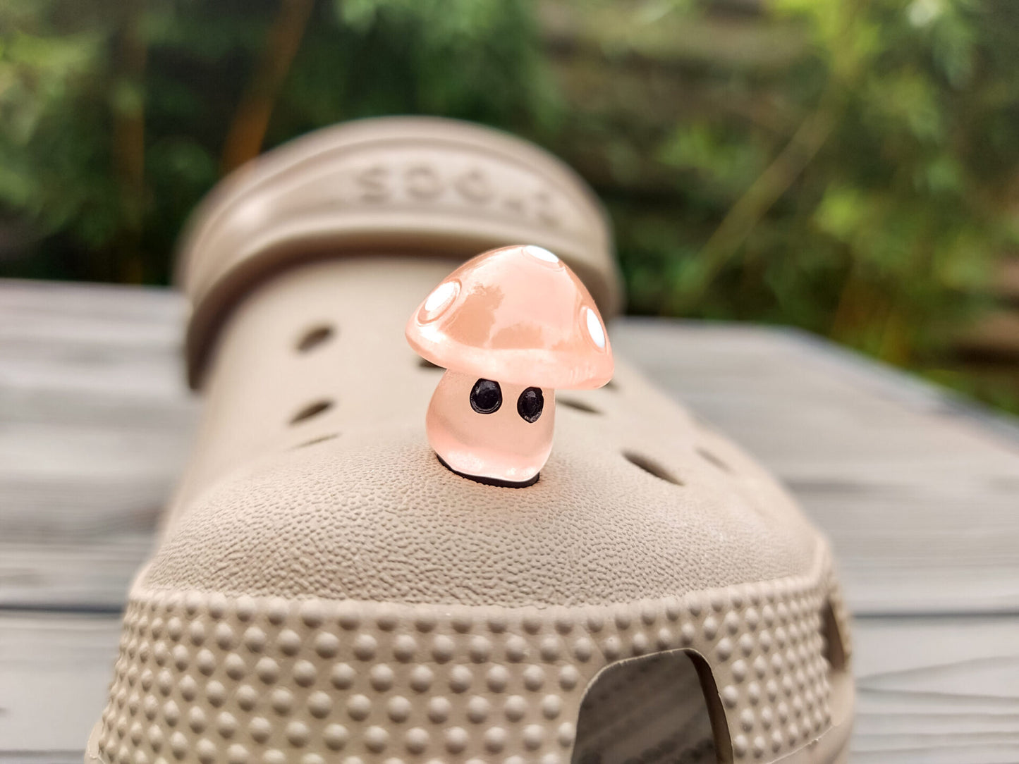 Glow-in-the-dark mushroom charms on a pair of shoes shoes. These luminous accessories add a magical, whimsical touch to your footwear, perfect for customizing with a unique forest-inspired design that glows beautifully in the dark.