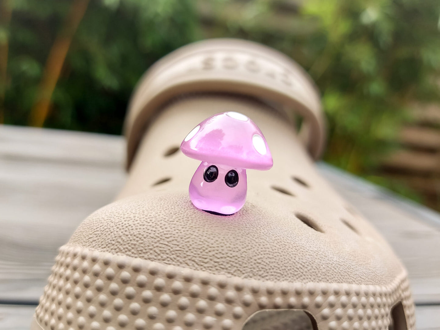 Glow-in-the-dark mushroom charms on a pair of shoes shoes. These luminous accessories add a magical, whimsical touch to your footwear, perfect for customizing with a unique forest-inspired design that glows beautifully in the dark.