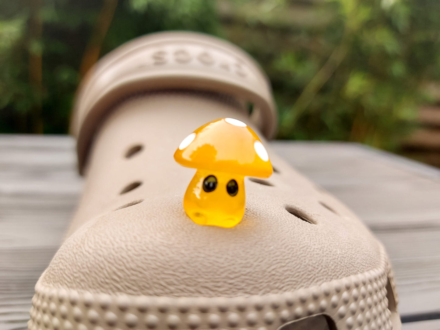 Glow-in-the-dark mushroom charms on a pair of shoes shoes. These luminous accessories add a magical, whimsical touch to your footwear, perfect for customizing with a unique forest-inspired design that glows beautifully in the dark.