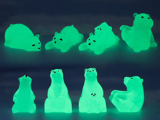 Tan shoes adorned with glow-in-the-dark polar bear charms and clear ice cube charms, set on a tree branch for an outdoor, nature-inspired photo. The polar bears are placed playfully around the shoe, adding a fun, wintry theme.