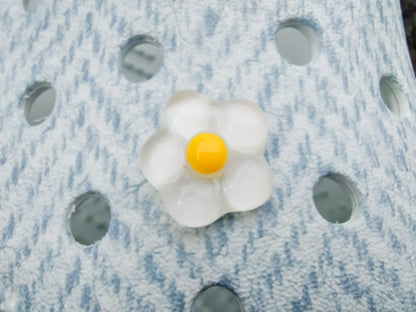 Close-up of a shoe decorated with a 5-piece jelly charm set, including two flowers, a yellow duck, a bunny with a pink bow, and a red mushroom. Each charm has a cute, soft, jelly-like appearance, adding a fun and playful vibe to the footwear.