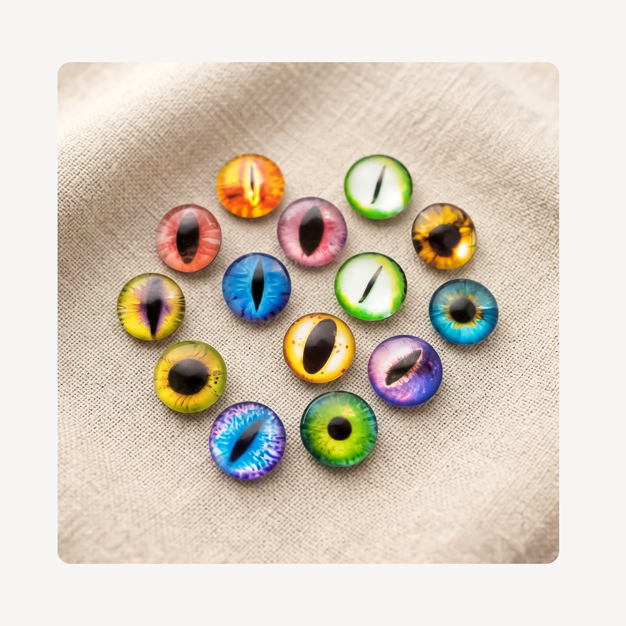 Twelve colorful round eye-shaped clog charms arranged in a circle on a beige textured fabric background.