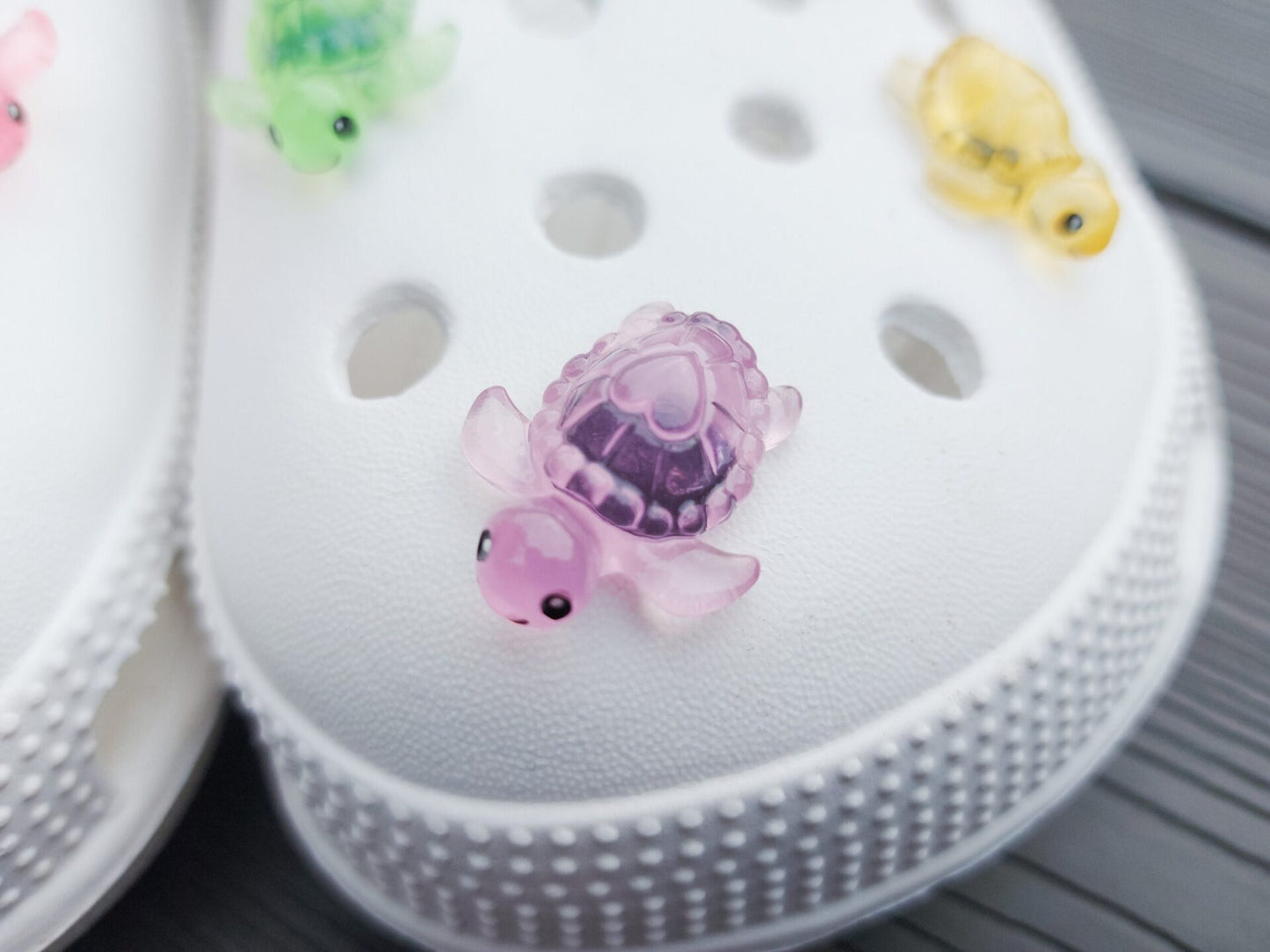 Glow-in-the-dark turtle charms for shoes, adding playful and whimsical style. These luminous accessories personalize your footwear with a fun touch, perfect for enhancing your shoes.