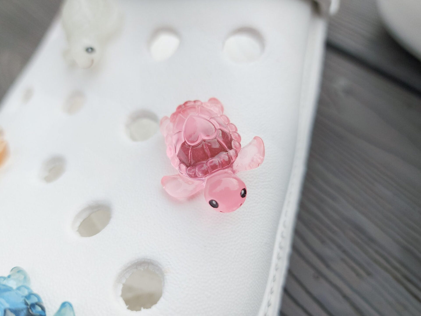 Glow-in-the-dark turtle charms for shoes, adding playful and whimsical style. These luminous accessories personalize your footwear with a fun touch, perfect for enhancing your shoes.
