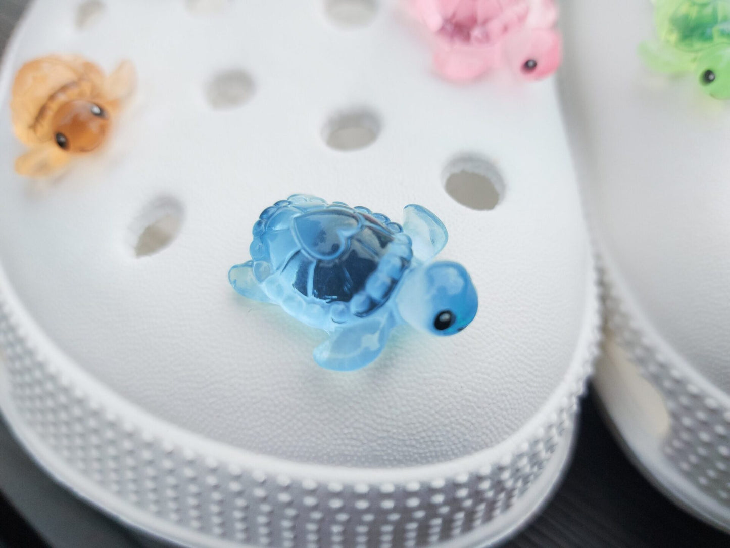 Glow-in-the-dark turtle charms for shoes, adding playful and whimsical style. These luminous accessories personalize your footwear with a fun touch, perfect for enhancing your shoes.