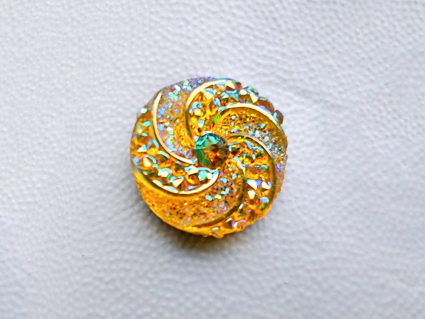 Colorful crystal round charms with sparkly rhinestones on a brown shoe shoe. These vibrant and glittering accessories add a dazzling touch to your footwear, perfect for customizing your shoes with a unique and eye-catching sparkle.
