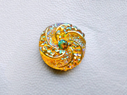 Colorful crystal round charms with sparkly rhinestones on a brown shoe shoe. These vibrant and glittering accessories add a dazzling touch to your footwear, perfect for customizing your shoes with a unique and eye-catching sparkle.