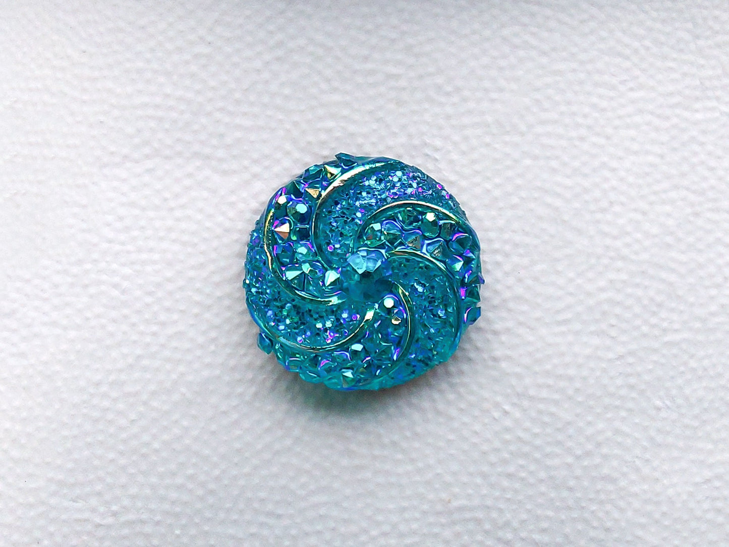Colorful crystal round charms with sparkly rhinestones on a brown shoe shoe. These vibrant and glittering accessories add a dazzling touch to your footwear, perfect for customizing your shoes with a unique and eye-catching sparkle.