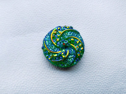 Colorful crystal round charms with sparkly rhinestones on a brown shoe shoe. These vibrant and glittering accessories add a dazzling touch to your footwear, perfect for customizing your shoes with a unique and eye-catching sparkle.