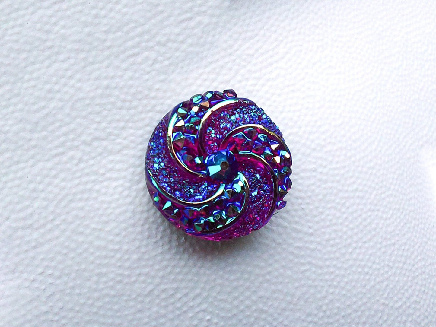 Colorful crystal round charms with sparkly rhinestones on a brown shoe shoe. These vibrant and glittering accessories add a dazzling touch to your footwear, perfect for customizing your shoes with a unique and eye-catching sparkle.