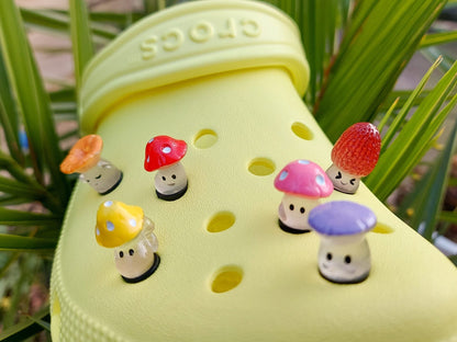 Glow-in-the-dark wild mushroom charms on a shoe shoe. These whimsical accessories light up in the dark, adding a magical and nature-inspired touch to your footwear. Perfect for customizing your shoes with a unique forest theme.
