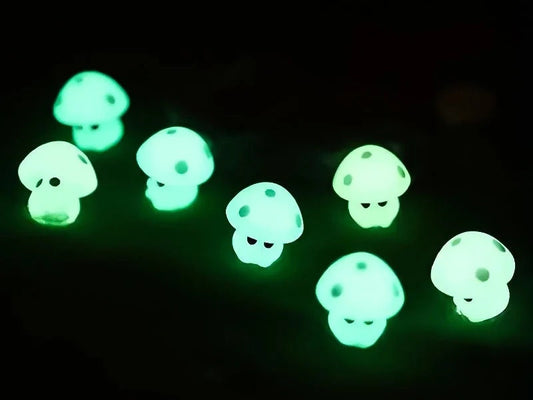 Glow-in-the-dark mushroom charms on a pair of shoes shoes. These luminous accessories add a magical, whimsical touch to your footwear, perfect for customizing with a unique forest-inspired design that glows beautifully in the dark.