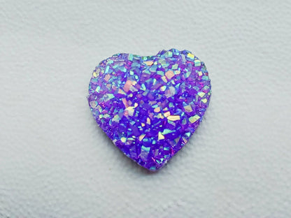 Sparkly and glittery rhinestone shoe charms in heart shapes on a pair of shoes shoes. Different colors such as silver, gold, rose, jade, amethyst, diamond.