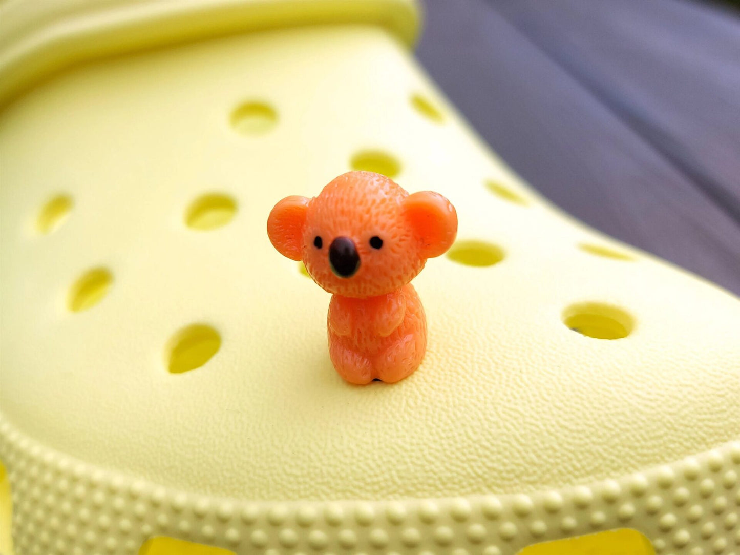 Colorful koala charms on a yellow shoes shoe. These cute koala bear charms have an Australian vibe that make it the perfect gift for any ozzy.