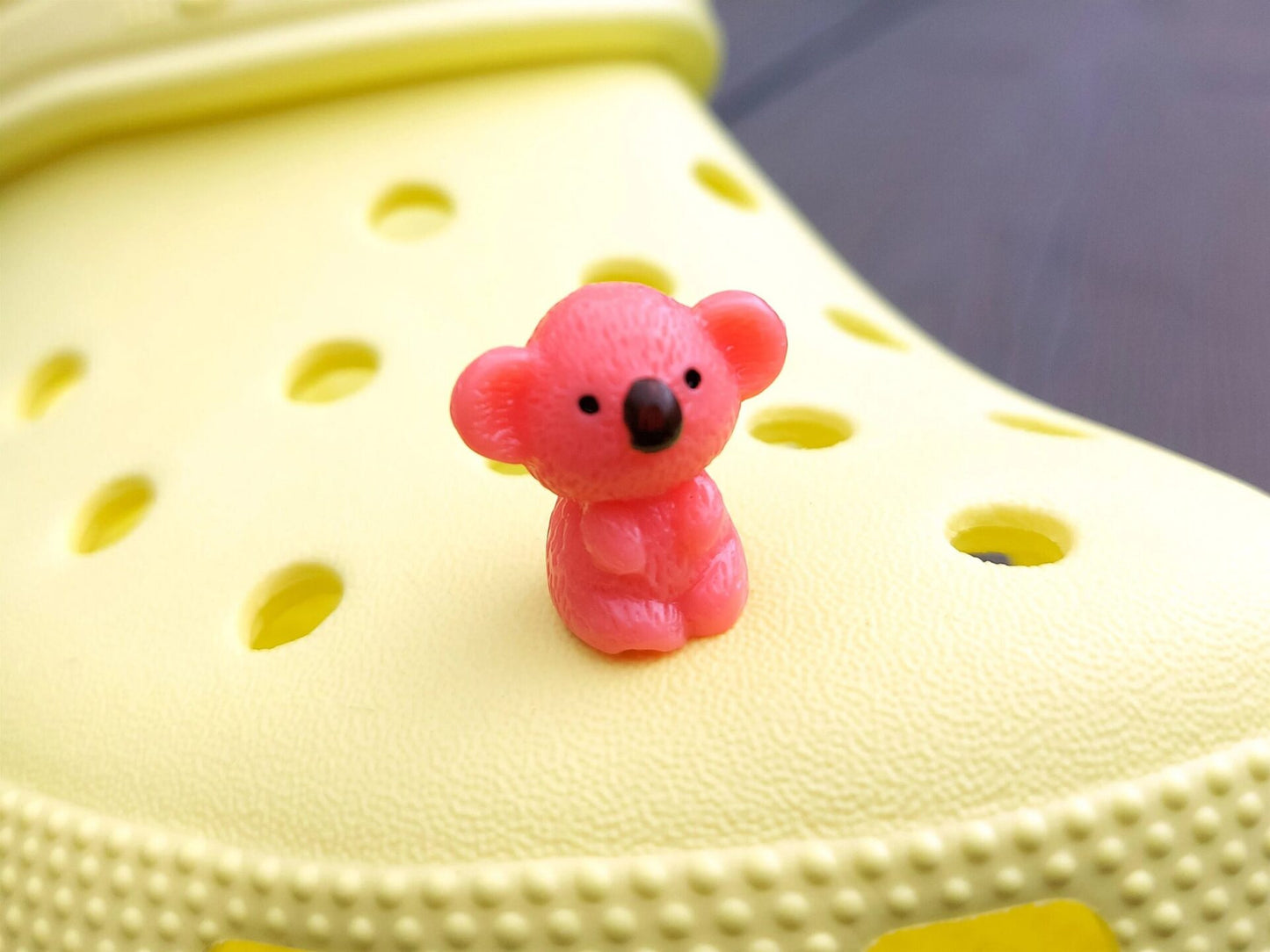 Colorful koala charms on a yellow shoes shoe. These cute koala bear charms have an Australian vibe that make it the perfect gift for any ozzy.