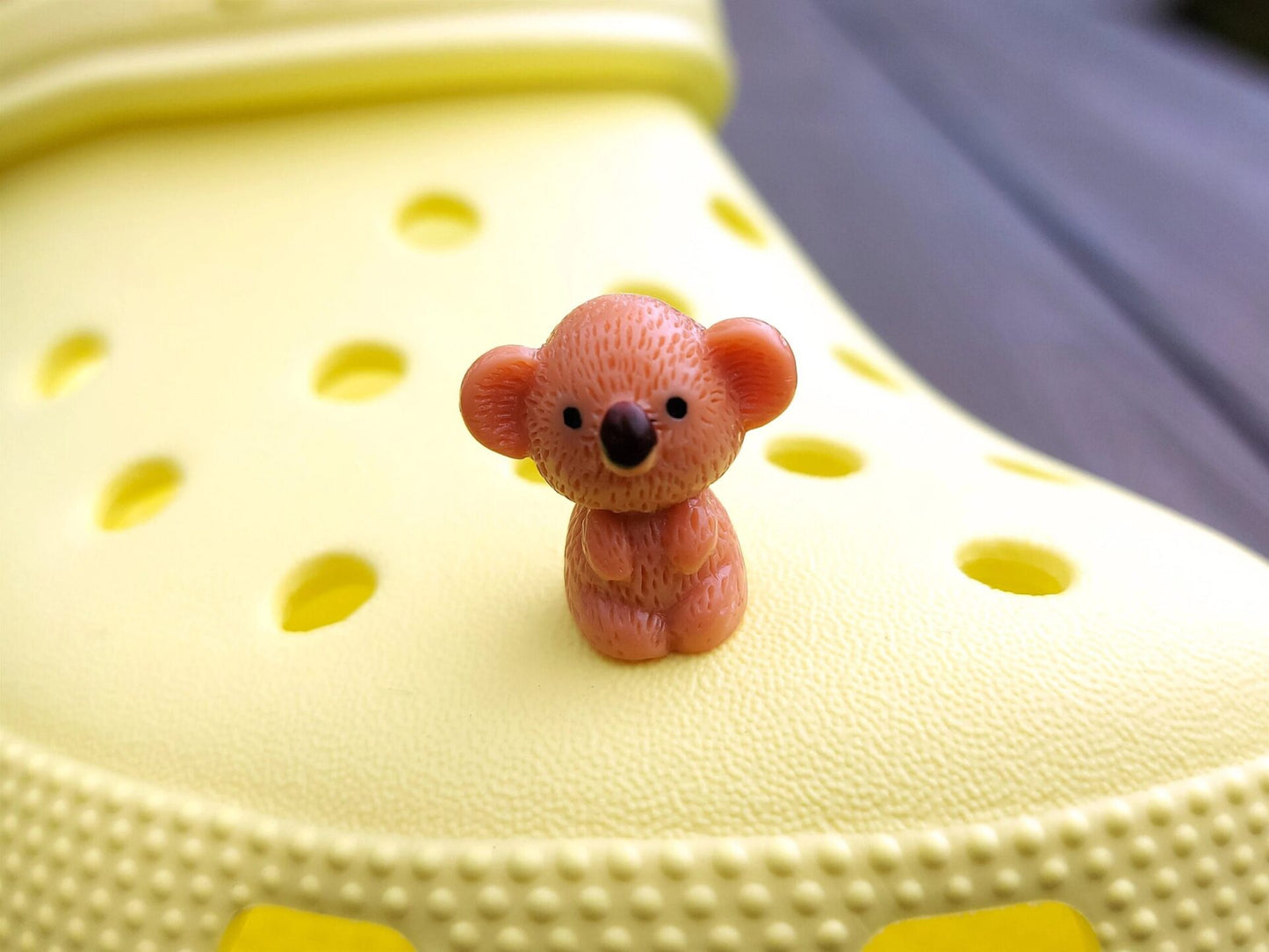 Colorful koala charms on a yellow shoes shoe. These cute koala bear charms have an Australian vibe that make it the perfect gift for any ozzy.