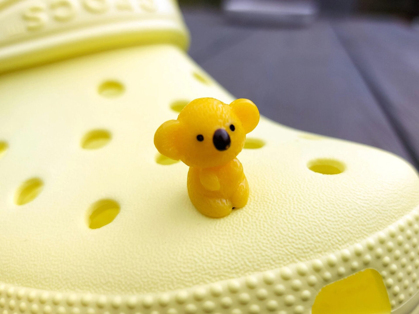 Colorful koala charms on a yellow shoes shoe. These cute koala bear charms have an Australian vibe that make it the perfect gift for any ozzy.