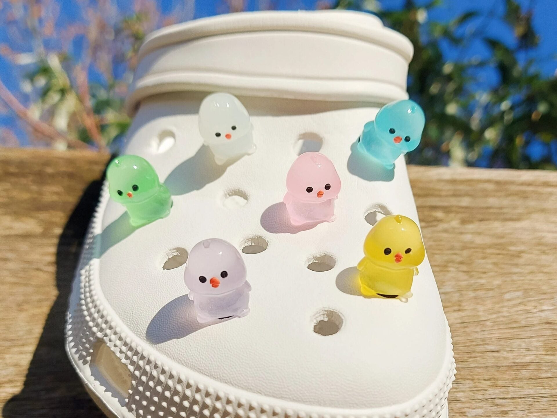 Glow-in-the-dark chicken shoe charms showcasing plump, colorful chickens with playful details like tiny wings and combs. Each charm glows in various neon shades, adding a fun and quirky touch to your shoes, perfect for farm animal lovers.