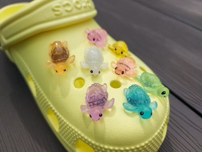 Glow-in-the-dark turtle charms for shoes, adding playful and whimsical style. These luminous accessories personalize your footwear with a fun touch, perfect for enhancing your shoes.