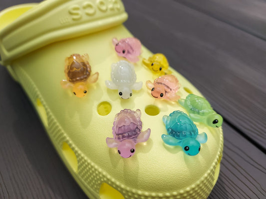Glow-in-the-dark turtle charms for shoes, adding playful and whimsical style. These luminous accessories personalize your footwear with a fun touch, perfect for enhancing your shoes.
