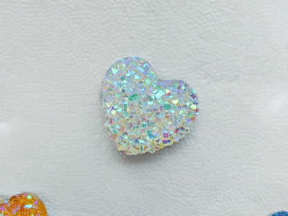 Sparkly and glittery rhinestone shoe charms in heart shapes on a pair of shoes shoes. Different colors such as silver, gold, rose, jade, amethyst, diamond.