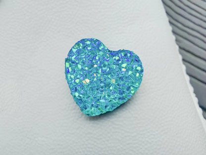 Sparkly and glittery rhinestone shoe charms in heart shapes on a pair of shoes shoes. Different colors such as silver, gold, rose, jade, amethyst, diamond.