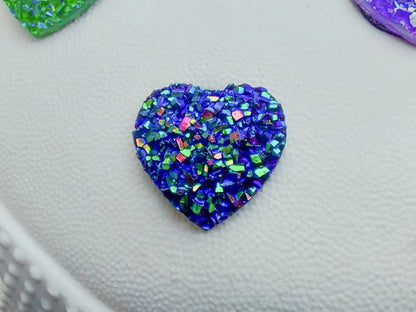 Sparkly and glittery rhinestone shoe charms in heart shapes on a pair of shoes shoes. Different colors such as silver, gold, rose, jade, amethyst, diamond.