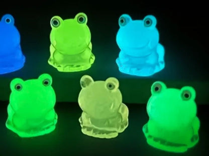 Glow-in-the-dark frog charms on a shoe shoe. These playful and luminous accessories add a fun, froggy touch to your footwear, making them perfect for customizing your shoes with a whimsical and adventurous vibe.