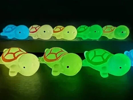 Glow-in-the-dark turtle charms on a shoe shoe. These adorable accessories, featuring detailed shell designs, bring a playful and luminous touch to the footwear, perfect for customizing your shoes with a fun, ocean-inspired look.