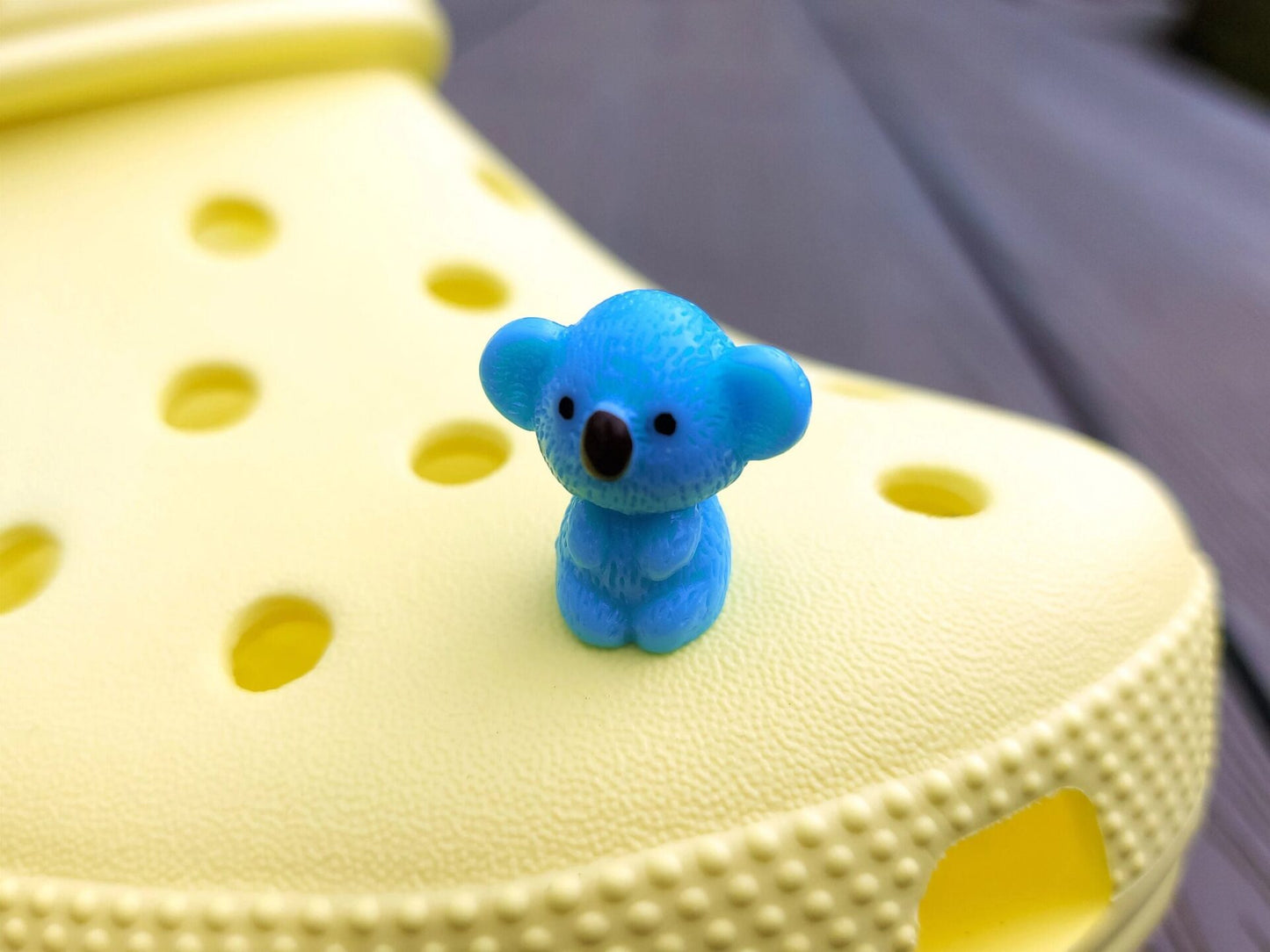 Colorful koala charms on a yellow shoes shoe. These cute koala bear charms have an Australian vibe that make it the perfect gift for any ozzy.