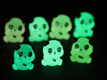Set of glow in the dark panda shoe charms displayed on a shoe shoe. The charms feature small panda bears in various colors, with a glowing effect. These adorable accessories are designed to light up in the dark.