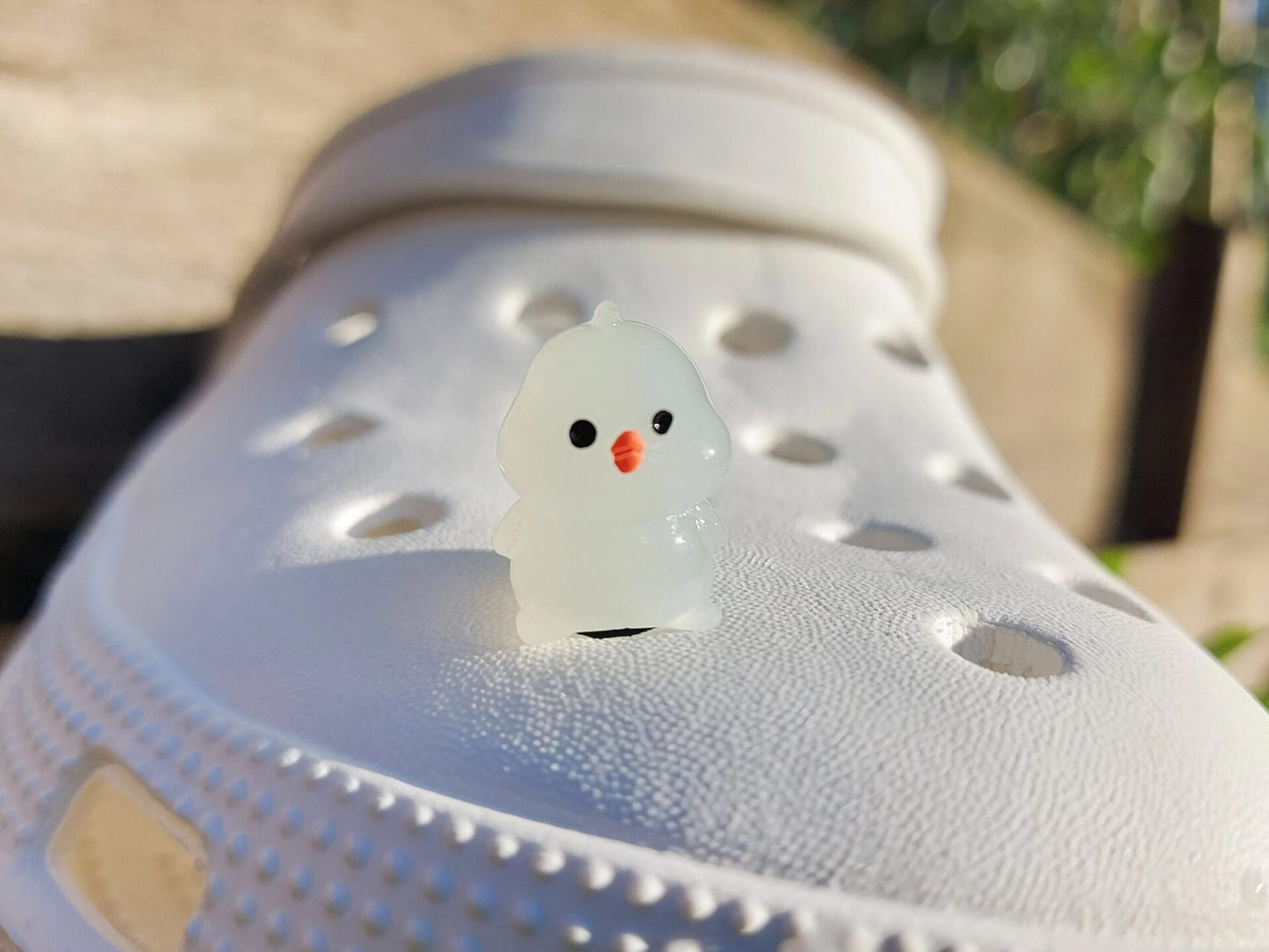 Glow-in-the-dark chicken shoe charms showcasing plump, colorful chickens with playful details like tiny wings and combs. Each charm glows in various neon shades, adding a fun and quirky touch to your shoes, perfect for farm animal lovers.