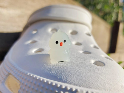 Glow-in-the-dark chicken shoe charms showcasing plump, colorful chickens with playful details like tiny wings and combs. Each charm glows in various neon shades, adding a fun and quirky touch to your shoes, perfect for farm animal lovers.