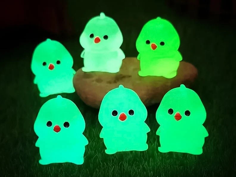 Glow-in-the-dark chicken shoe charms showcasing plump, colorful chickens with playful details like tiny wings and combs. Each charm glows in various neon shades, adding a fun and quirky touch to your shoes, perfect for farm animal lovers.