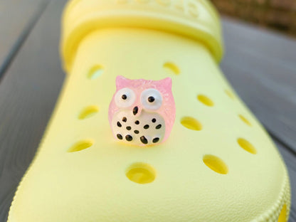 Glow-in-the-dark owl shoe charms featuring small, colorful owls with wide eyes and feathered details. These cute owls glow brightly in the dark, adding a magical and whimsical look to your shoes, perfect for those who love nocturnal creatures.