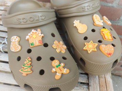A collection of gingerbread-themed shoe charms shaped like Christmas trees, snowflakes, and stars, each with a realistic cookie appearance. These festive charms add a cozy, holiday-inspired touch to your footwear.