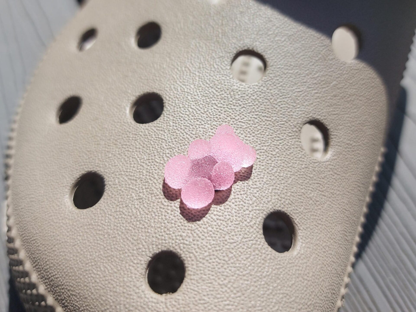 Close-up of sugar gummy bear charms on a shoe shoe, featuring bright, colorful gummy bear designs. The charms are securely attached, adding a playful, candy-inspired touch to the shoe with a fun and vibrant look.