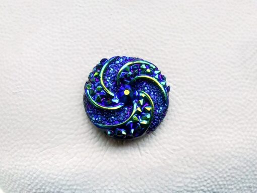 Colorful crystal round charms with sparkly rhinestones on a brown Croc shoe. These vibrant and glittering accessories add a dazzling touch to your footwear, perfect for customizing your Crocs with a unique and eye-catching sparkle.