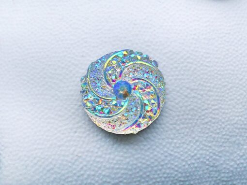 Colorful crystal round charms with sparkly rhinestones on a brown Croc shoe. These vibrant and glittering accessories add a dazzling touch to your footwear, perfect for customizing your Crocs with a unique and eye-catching sparkle.