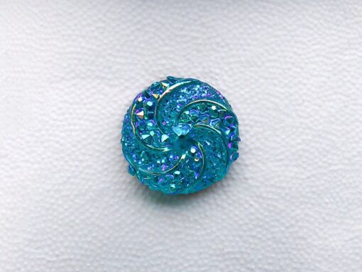 Colorful crystal round charms with sparkly rhinestones on a brown Croc shoe. These vibrant and glittering accessories add a dazzling touch to your footwear, perfect for customizing your Crocs with a unique and eye-catching sparkle.