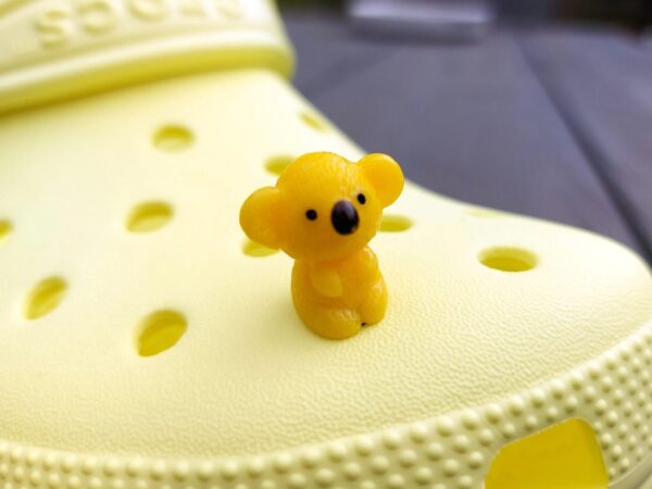 Colorful koala charms on a yellow Crocs shoe. These cute koala bear charms have an Australian vibe that make it the perfect gift for any ozzy.