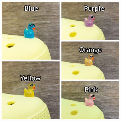 Glow-in-the-dark Croc charms shaped like cool ducks wearing sunglasses. These vibrant ducks come to life in the dark, glowing in neon shades while their tiny black sunglasses add a playful, stylish touch to your Crocs.