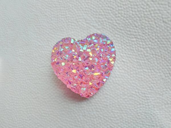 Sparkly and glittery rhinestone shoe charms in heart shapes on a pair of Crocs shoes. Different colors such as silver, gold, rose, jade, amethyst, diamond.