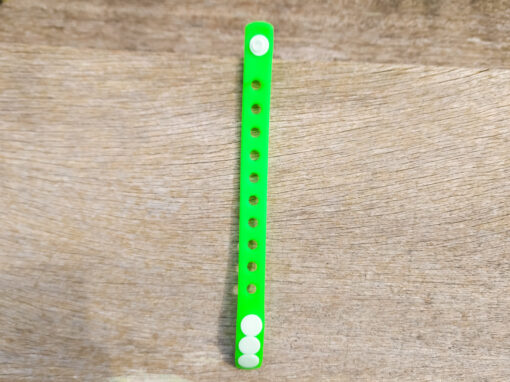 A flexible, adjustable bracelet with multiple charm slots, available in a range of vibrant colors for a personalized look.