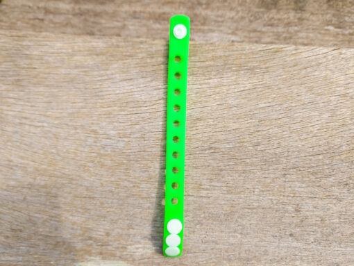 A flexible, adjustable bracelet with multiple charm slots, available in a range of vibrant colors for a personalized look.