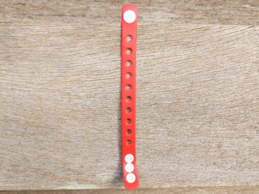 A flexible, adjustable bracelet with multiple charm slots, available in a range of vibrant colors for a personalized look.