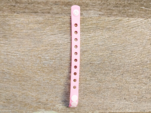 A flexible, adjustable bracelet with multiple charm slots, available in a range of vibrant colors for a personalized look.