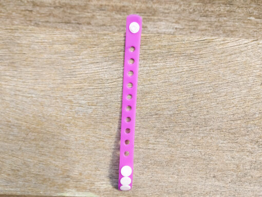 A flexible, adjustable bracelet with multiple charm slots, available in a range of vibrant colors for a personalized look.