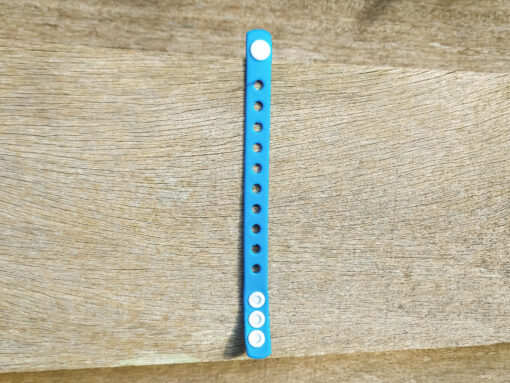A flexible, adjustable bracelet with multiple charm slots, available in a range of vibrant colors for a personalized look.